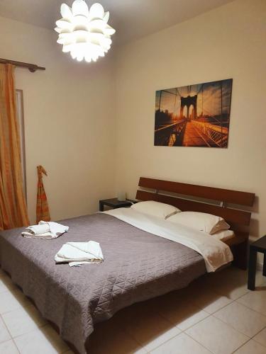 a bedroom with a bed with two towels on it at My village home in Ioannina