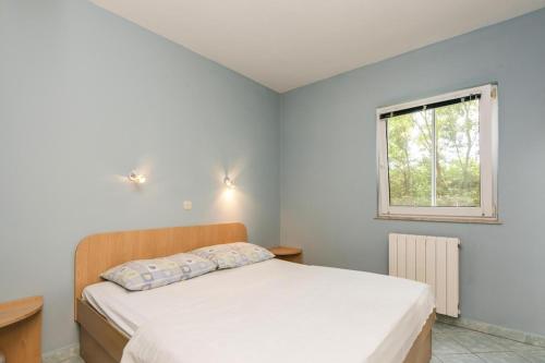 Postel nebo postele na pokoji v ubytování Apartments Rosmary, Zaton, with pool
