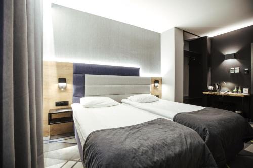 a hotel room with two beds in a room at Air Hotel in Warsaw