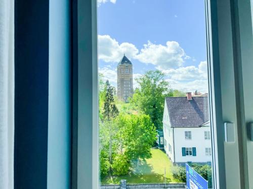 a window with a view of a clock tower at Best Western and Hotel Linkoping in Linköping
