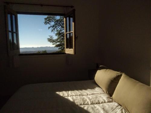 A bed or beds in a room at Posada Las Vertientes