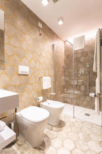 a bathroom with a toilet and a sink and a shower at Antico Podere San Francesco in Vada