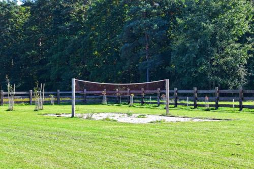 a volleyball net in the middle of a field at Leśny Zakątek Uroczysko in Rychtal