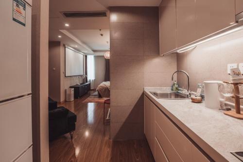 Η κουζίνα ή μικρή κουζίνα στο Tianjin G'apartment - Five Great Avenues