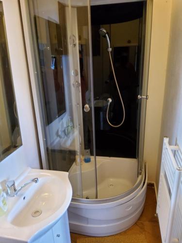 a bathroom with a shower and a sink at London 3 call in Bratislava