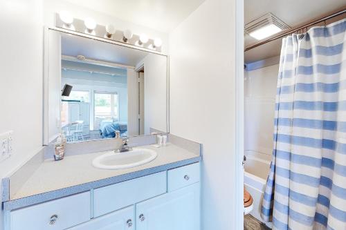 a bathroom with a sink and a mirror at Sand & Beach Within Reach in North Truro