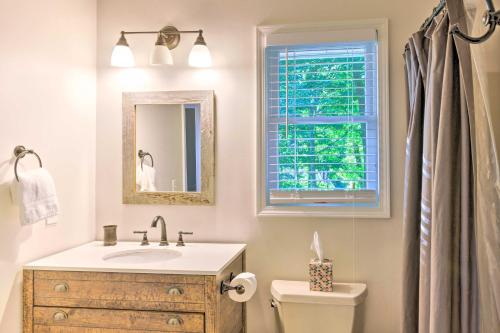 a bathroom with a sink and a toilet and a window at Highlands Home with Fireplace, Views, and Trails! in Highlands