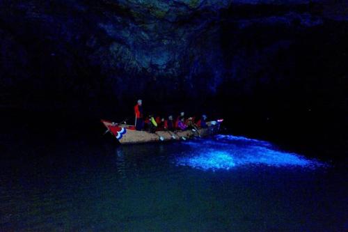 a group of people in a boat in the water at East Mountain Light Brigade in Nangan