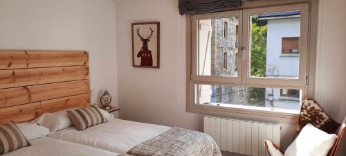 Postel nebo postele na pokoji v ubytování Casa El Cajico alojamiento vacacional en Panticosa