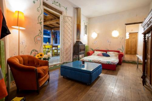 a living room with a bed and a couch at Attico incantato in Rome