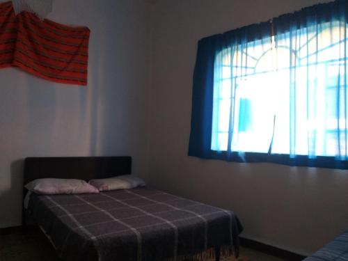 Ένα ή περισσότερα κρεβάτια σε δωμάτιο στο Hostal Azul Puebla