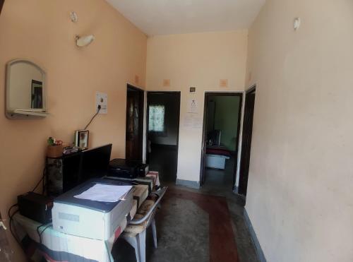 a room with a room with boxes in it at Pahaadi House Homestay in Dāngchura