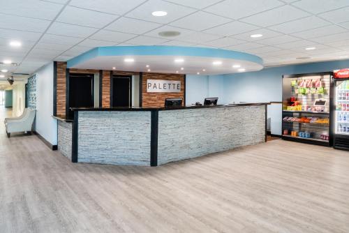 a lobby of a pharmacy with a counter in a store at Palette Resort Myrtle Beach in Myrtle Beach