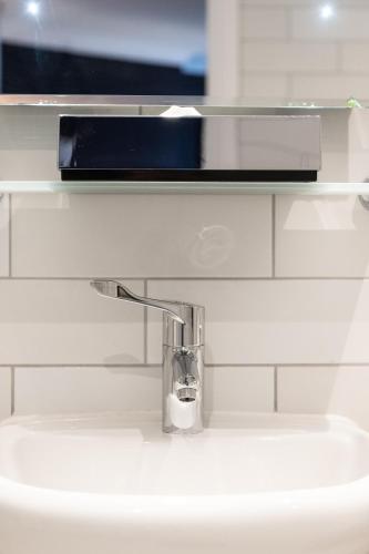 a bathroom sink with a chrome faucet at Miller & Carter Brighton by Innkeeper's Collection in Brighton & Hove