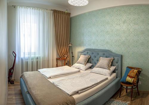 Ein Bett oder Betten in einem Zimmer der Unterkunft Šaulių apartamentai ! In the heart of Klaipeda center