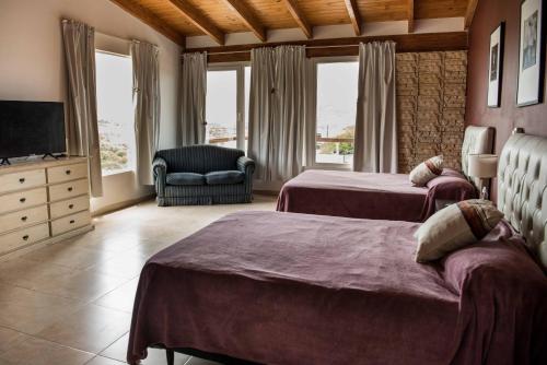 Ένα ή περισσότερα κρεβάτια σε δωμάτιο στο Casa Soñada reserva natural piletas & vistas Carlos Paz