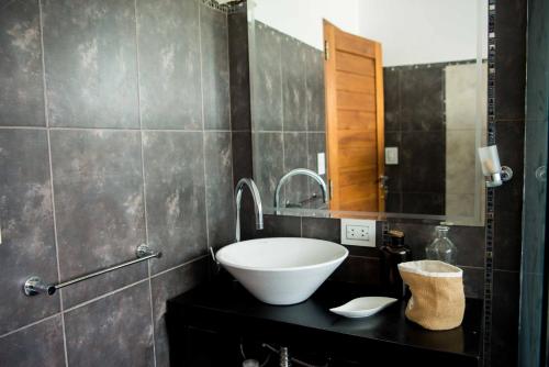 a bathroom with a sink and a mirror at Casa de montaña - Carlos Paz in Villa Carlos Paz