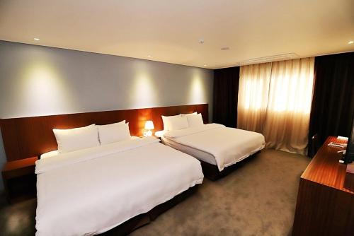 Katil atau katil-katil dalam bilik di Sea Moon Tourist Hotel