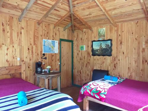 Las Cataratas Lodge tesisinde bir odada yatak veya yataklar