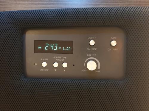 an oven with a clock on the front of it at Cabin & Capsule Hotel J-SHIP Osaka Namba in Osaka