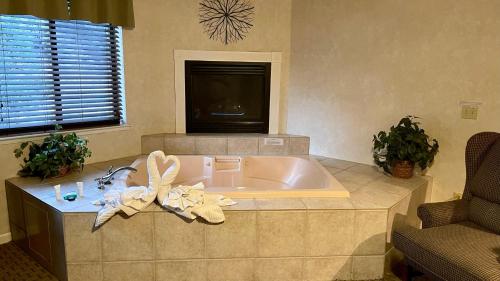 a bath tub in a kitchen with a sink at Yosemite View Lodge in El Portal