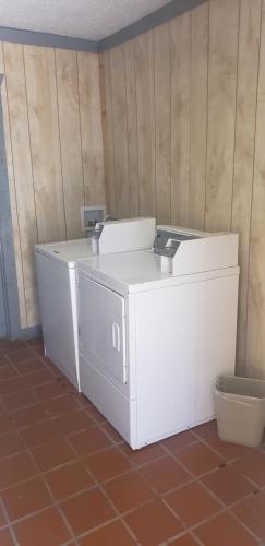 a room with two white refrigerators sitting on the floor at Gold Key Inn in Brady