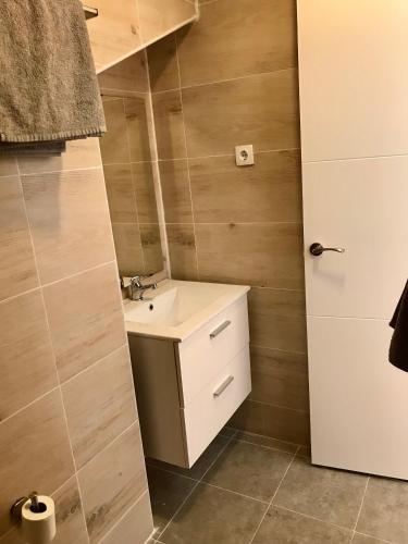 a bathroom with a sink and a mirror at Vistas al mar 2 Canabal in A Coruña