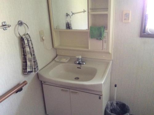 a bathroom with a sink and a mirror at Cafe Restaurant Umi no Yado Awaji Island - Vacation STAY 61253v in Awaji