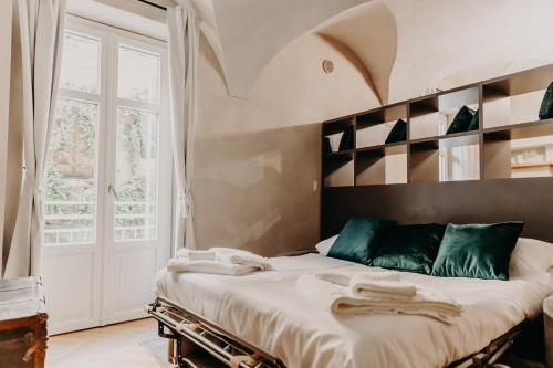 Giường trong phòng chung tại Le Dimore di Piazza