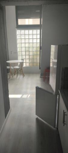 an empty room with a table and a table sidx sidx sidx at valencialoft in Valencia