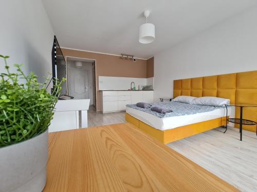 Ένα ή περισσότερα κρεβάτια σε δωμάτιο στο Perfect Stay - "Apartamenty Horzyca"