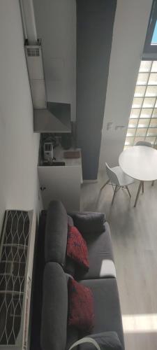 a living room with a couch and a table at valencialoft in Valencia