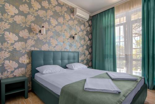 Кровать или кровати в номере "Le Sea" HOTEL AND PARK