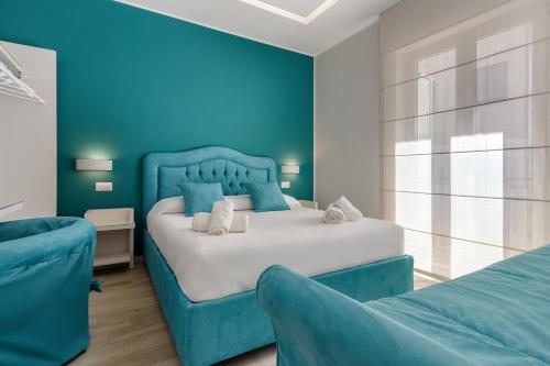 Postel nebo postele na pokoji v ubytování Tiffany Suites