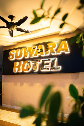 a sign on the wall of a hotel at Suwara Hotel Kepong KL in Kuala Lumpur