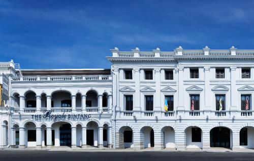 a white building with a balcony on top of it at Royale Chulan Penang in George Town