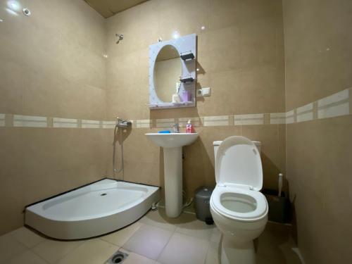 a bathroom with a toilet and a sink and a bath tub at Argishti street, 2 bedrooms Spacious, Sunny apartment GL148 in Yerevan