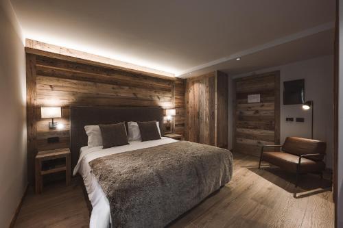 Postel nebo postele na pokoji v ubytování Hotel Alù Mountain Design