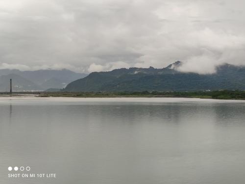 a large body of water with mountains in the background at Jiji Village Villa B&B in Lugu Lake
