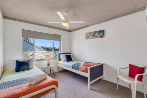 a bedroom with two beds and a window at Wintersview 2 - Lennox Head in Lennox Head