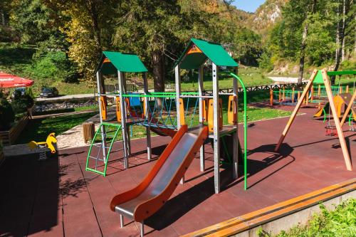 a playground with a slide in a park at Anin Dvor Šekovići in Šekovići