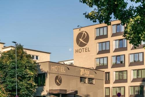 a hotel in front of a building at Rufi's Hotel Innsbruck in Innsbruck
