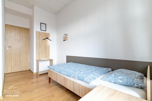 Postel nebo postele na pokoji v ubytování Hostel Katowice Centrum