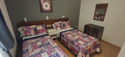 Ein Bett oder Betten in einem Zimmer der Unterkunft Hostal Felipe V