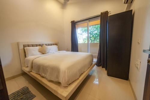 Cama o camas de una habitación en Goa Junction by Daystar Ventures