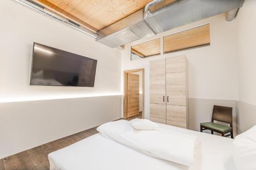 Postel nebo postele na pokoji v ubytování Chalets am Badesee Lassing