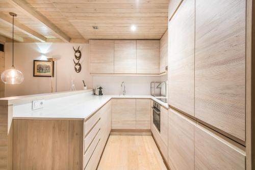 A kitchen or kitchenette at Dossau By Totiaran