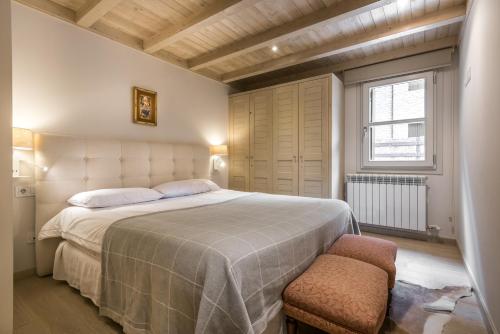 A bed or beds in a room at Dossau By Totiaran