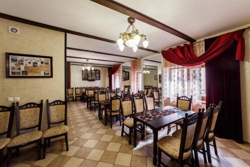 a dining room with a table and chairs at Patkovski in Bukovel