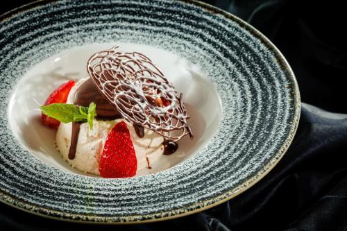 a plate with a dessert with strawberries and chocolate at Marvie Hotel & Health in Split